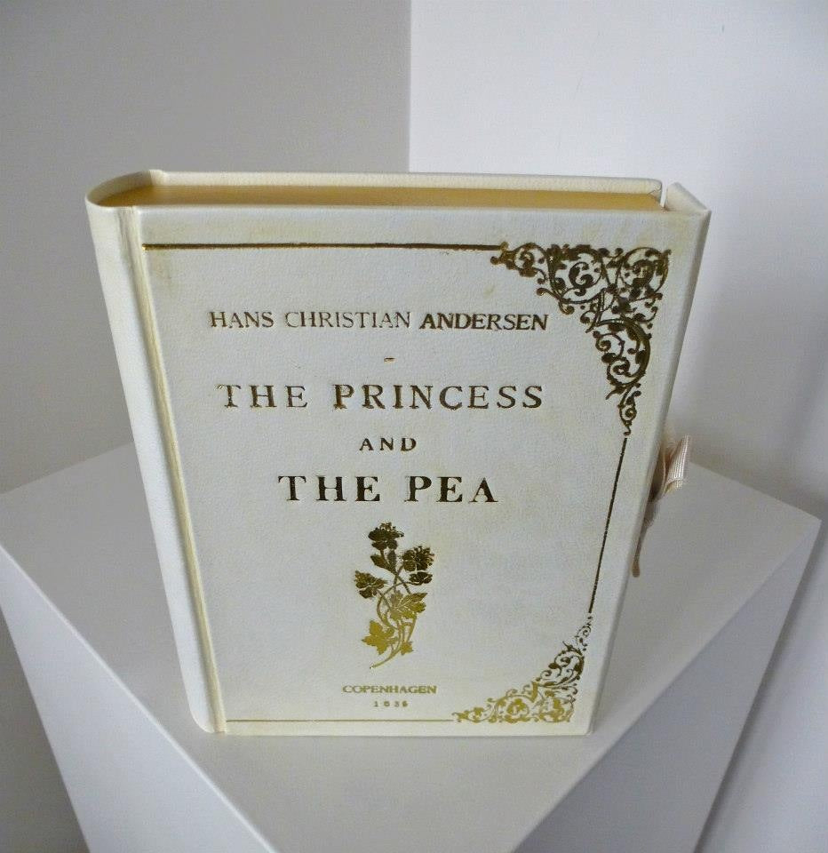 Poppy Delevingne the princess and the pea bespoke white book-clutch designed by Maria Marigliano Caracciolo of By M. Design