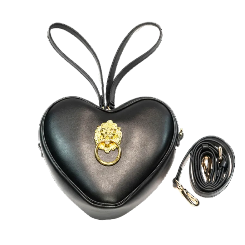 Heart-shaped black handbag with gold lion head clasp on a white background