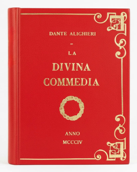 Red book -clutch  bagtitled 'La Divina Commedia' by Dante Alighieri with gold decorative elements on a white background. designed by maria marigliano caracciolo in a bookbindery